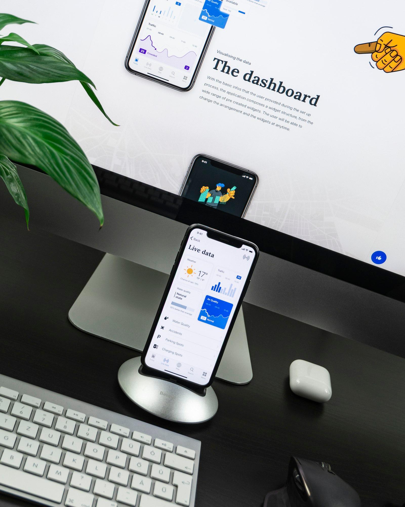 A desk with a phone on a stand