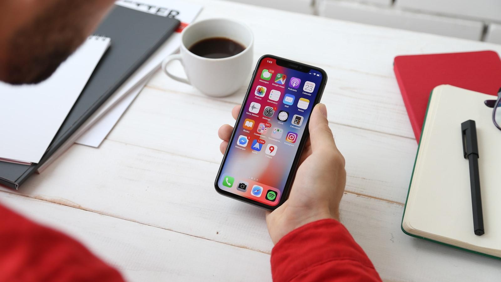 A hand holding a phone